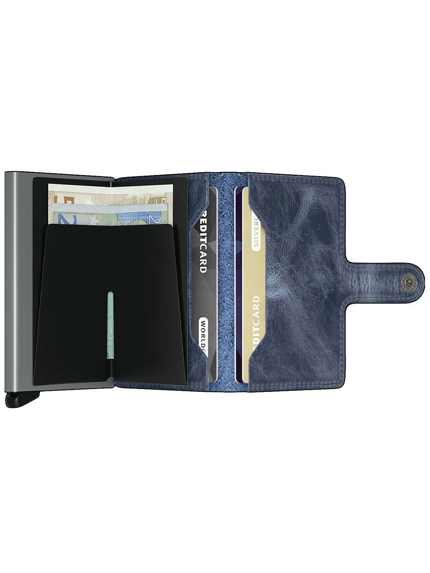 An open Secrid Miniwallet Vintage in Blue with slots containing cards and a compartment with euro banknotes.