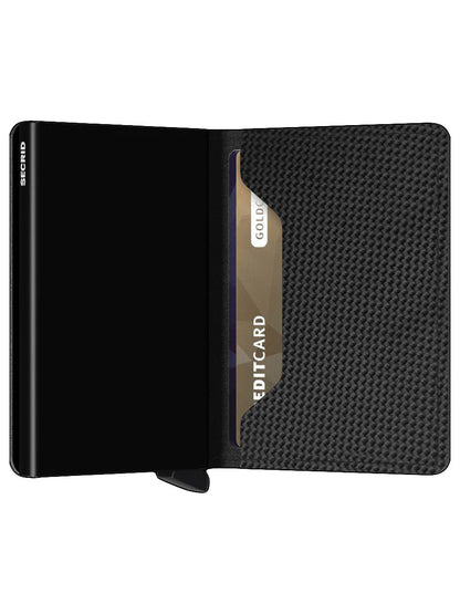 A sleek black Secrid Slimwallet Carbon in Black with a credit card inside, featuring an aluminium protects design and Cardprotector mechanism.