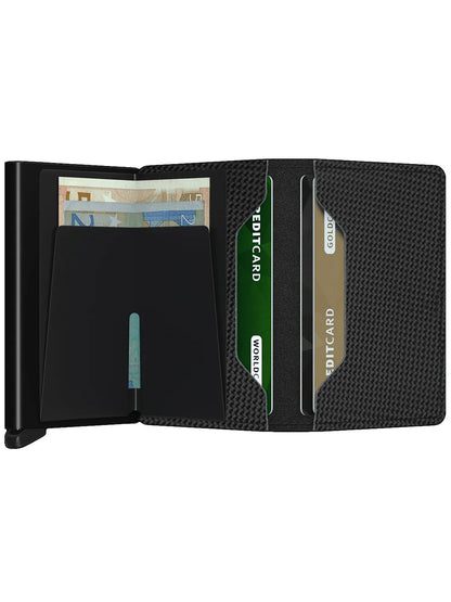 A Secrid Slimwallet Carbon in Black with a green card securely stored in a black aluminium Cardprotector mechanism.