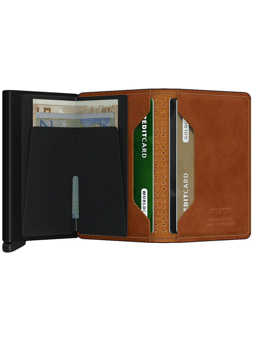Open Secrid Slimwallet Perforated in Cognac displaying cash and credit cards with RFID protection.
