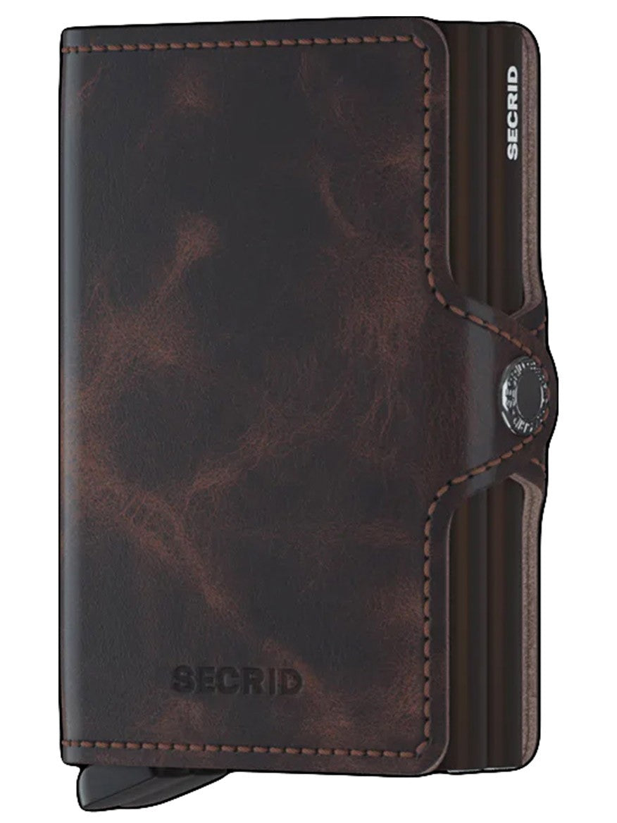 A compact-sized Secrid Twinwallet Vintage in Chocolate with a brown leather cover suitable for holding banknotes.