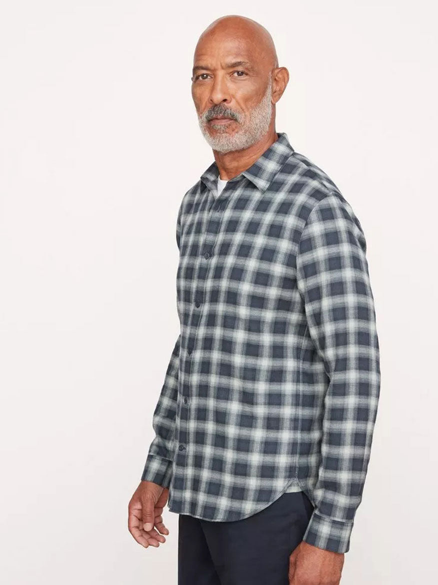 A man with a bald head and beard wears a sophisticated Vince Glen Oak Plaid Long Sleeve Shirt in Deep Seaweed, standing against a plain background.