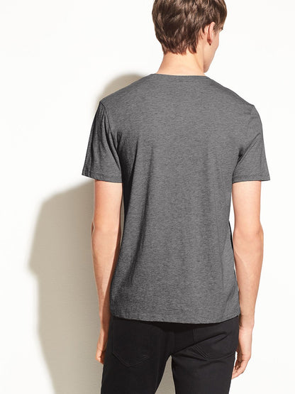 Man wearing a Vince Crew Neck T-Shirt in Heather Carbon, viewed from behind.