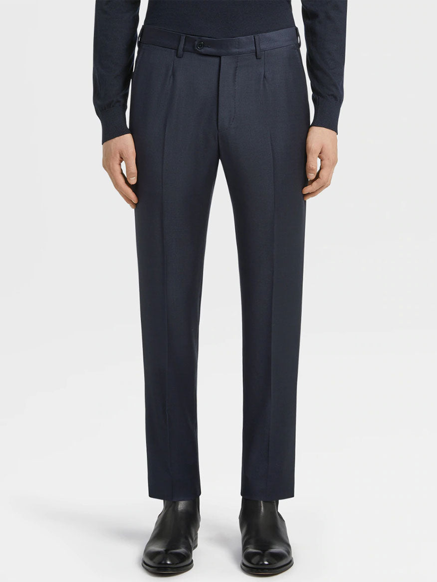 Man wearing Zegna Navy Blue Milano Trofeo™ Wool Suit dress pants with a pinpoint pattern and black shoes, crafted from Trofeo™ wool.